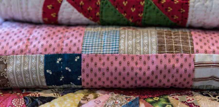 Photo of colorful quilts stacked